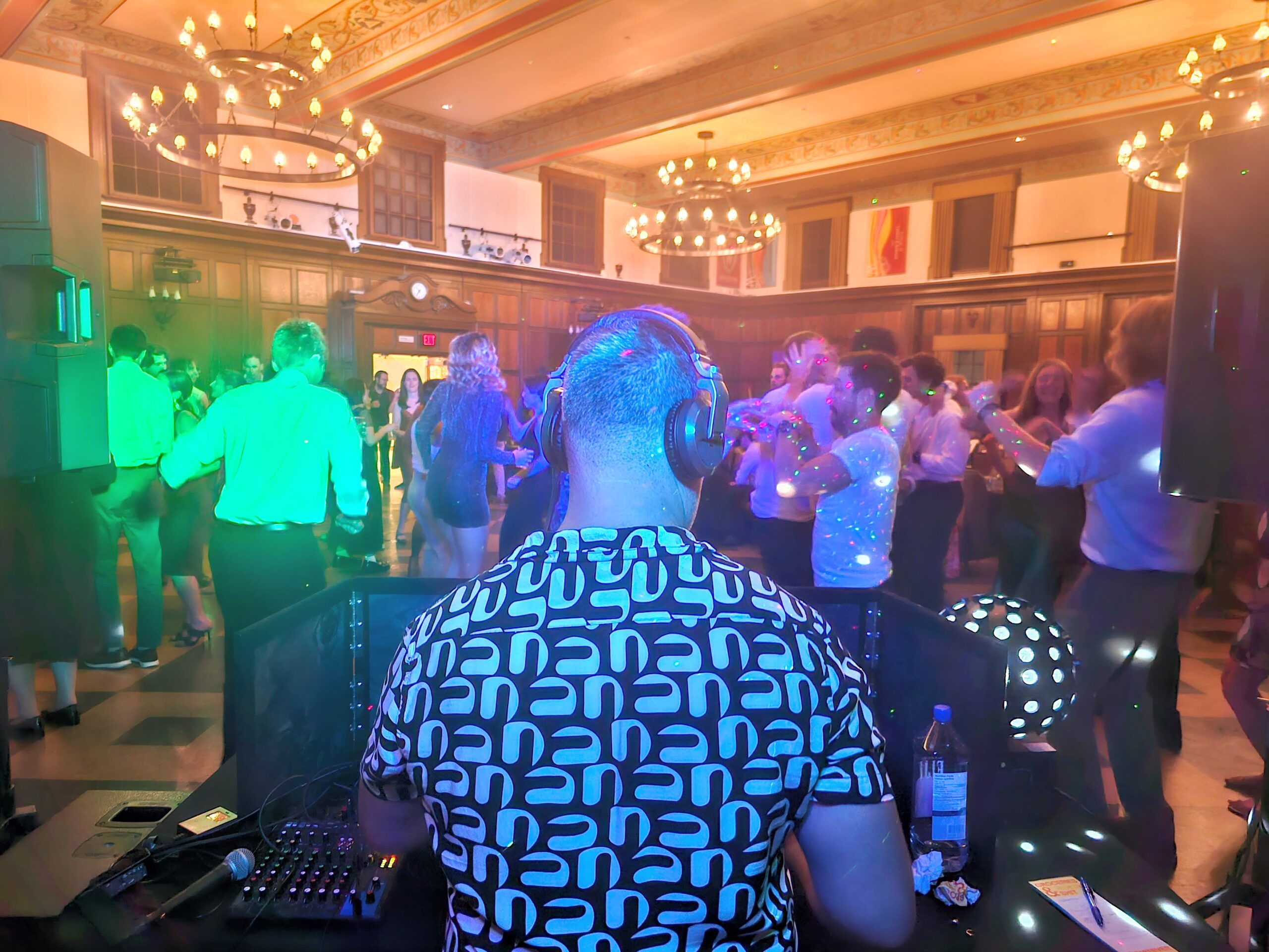 Crowded dance floor with club lighting